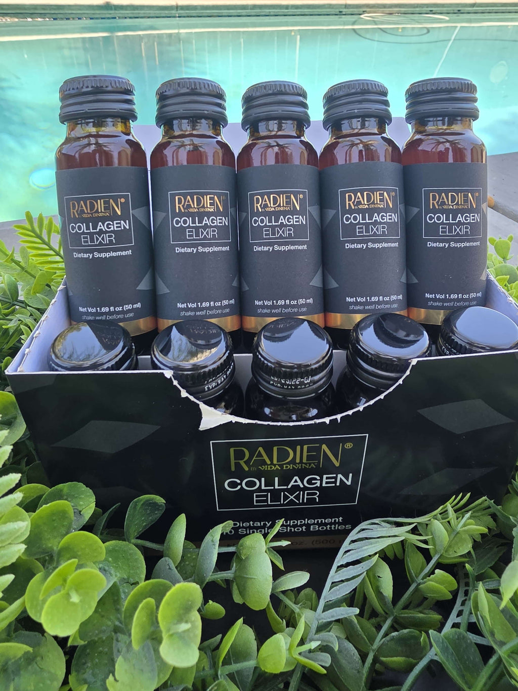 Pack of Radien Collagen Elixir bottles arranged in a box, dietary supplement for healthy skin.